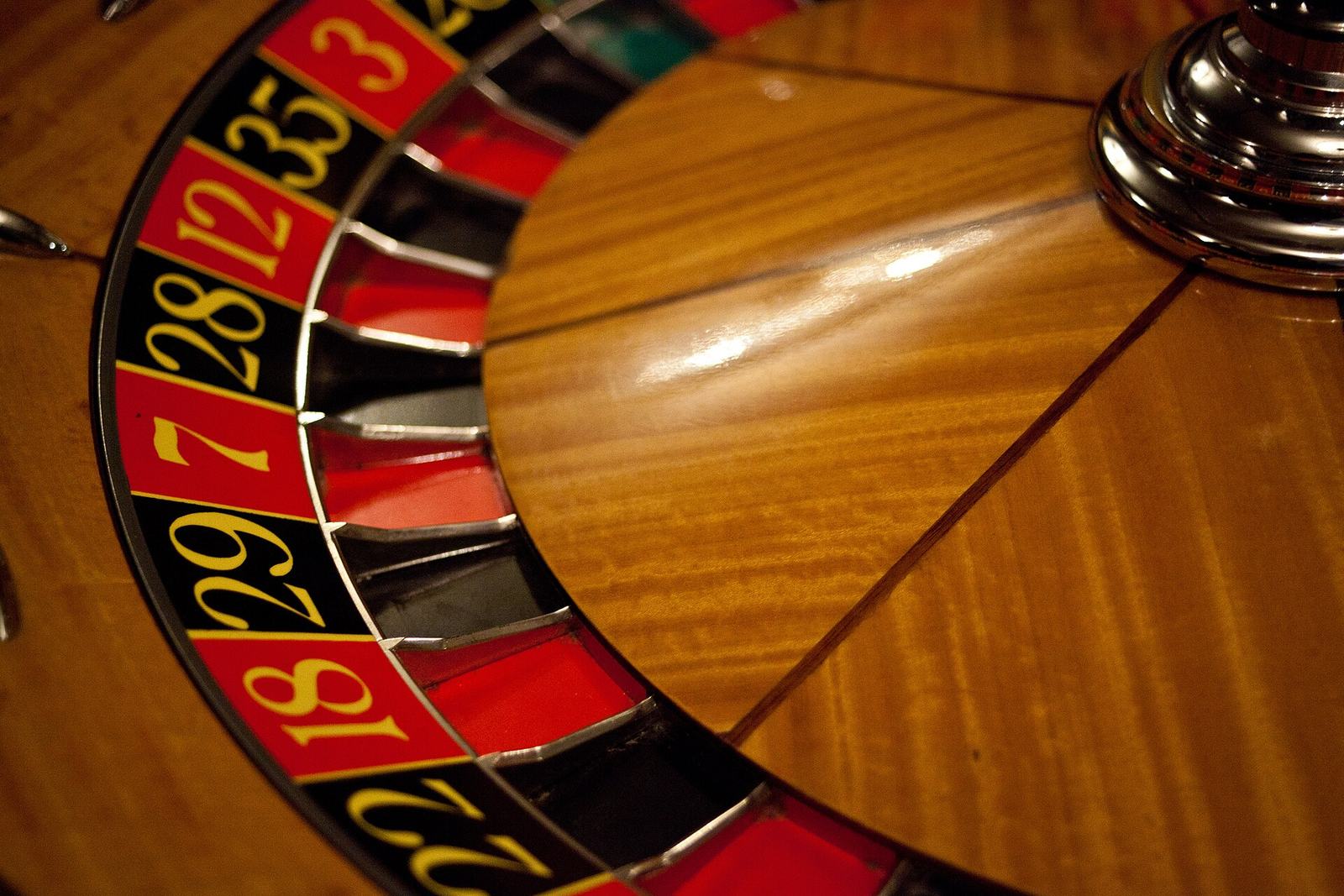 Close-up of a casino roulette wheel with numbered pockets